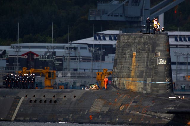 A trident submarine makes it's way out from Faslane Naval base on September 23, 2009 in Faslane, Scotland.