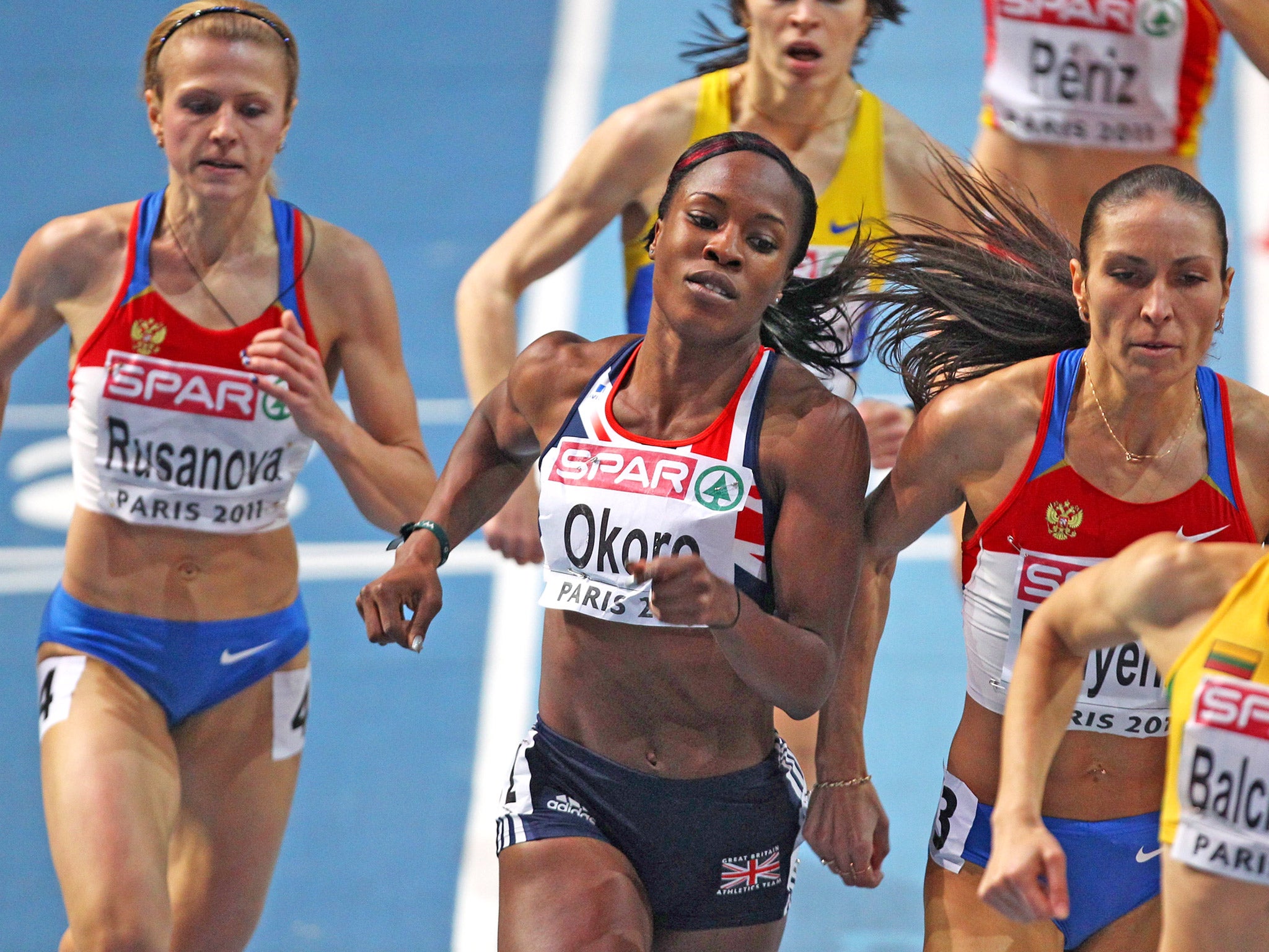 Marilyn Okoro runs during the 2011 Paris Championships. Yuliya Rusanova, left, has been caught doping