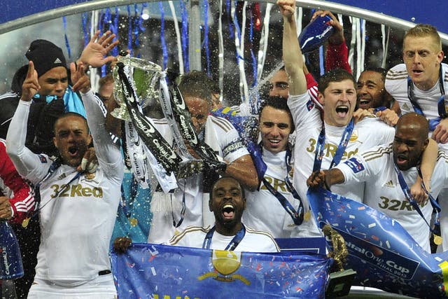 Swansea celebrate with the club's first ever major trophy