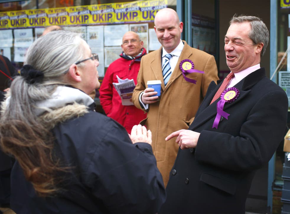 Nigel Farage talks to a local in Eastleigh yesterday