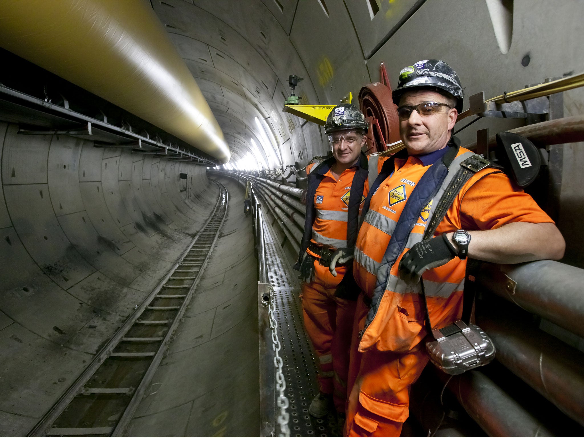 Workers tunnelling in the Western tunnels. The new Crossrail route being dug from Maidenhead and Heathrow in the west to Shenfield and Abbey Wood in the east includes a 26 mile section of tunnels