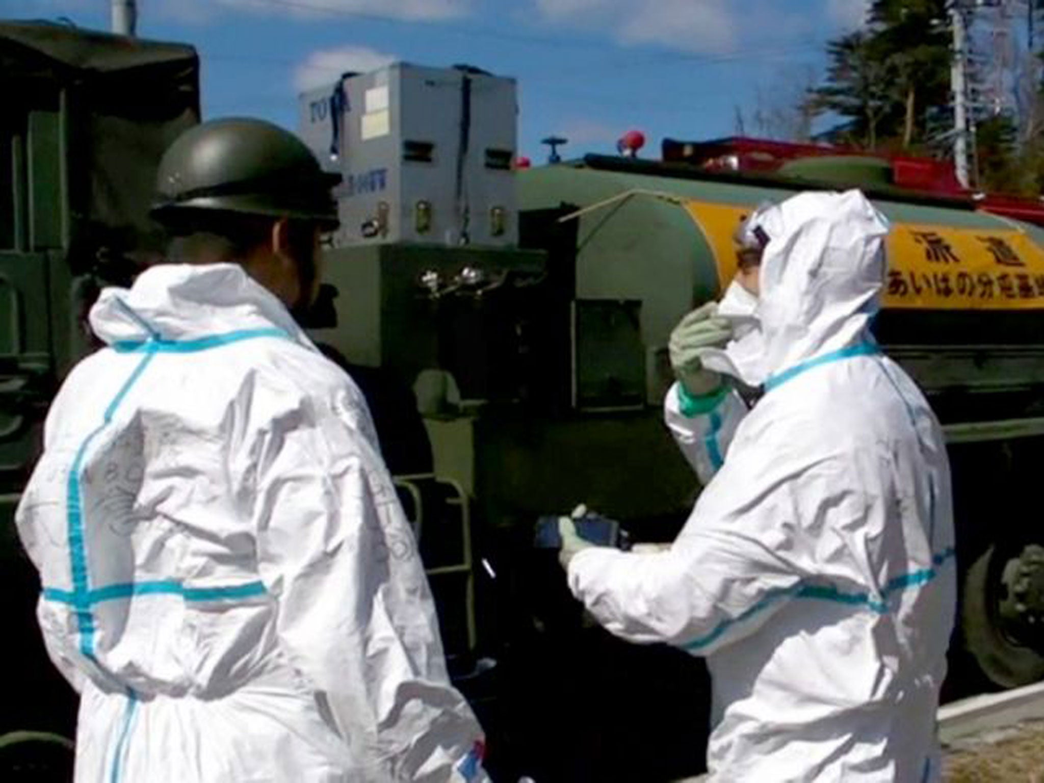 Workers amid the damage wrought by the tsunami and explosions at the Fukushima Daiichi plant in 2011