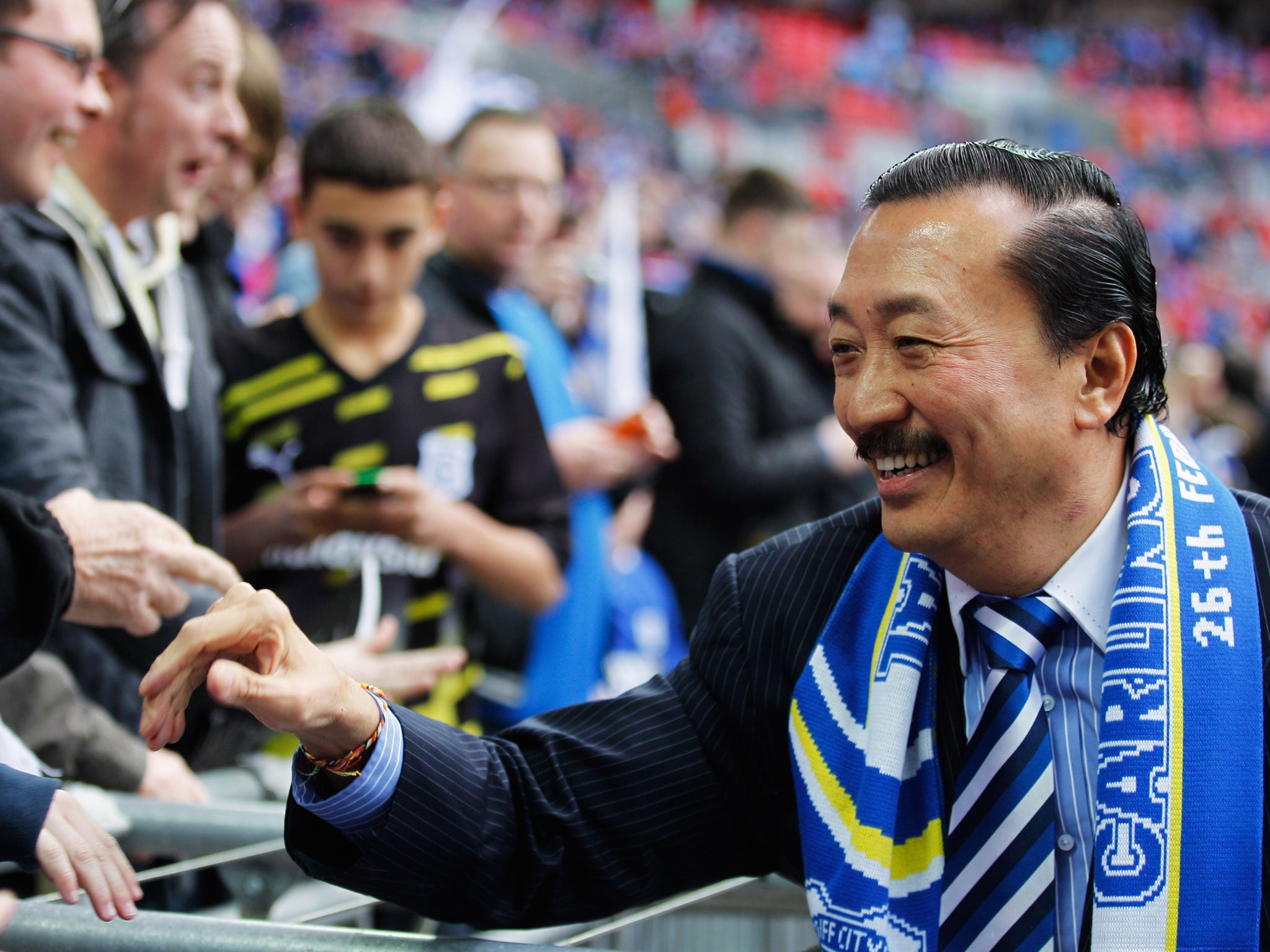 Cardiff City’s owner Vincent Tan greets fans