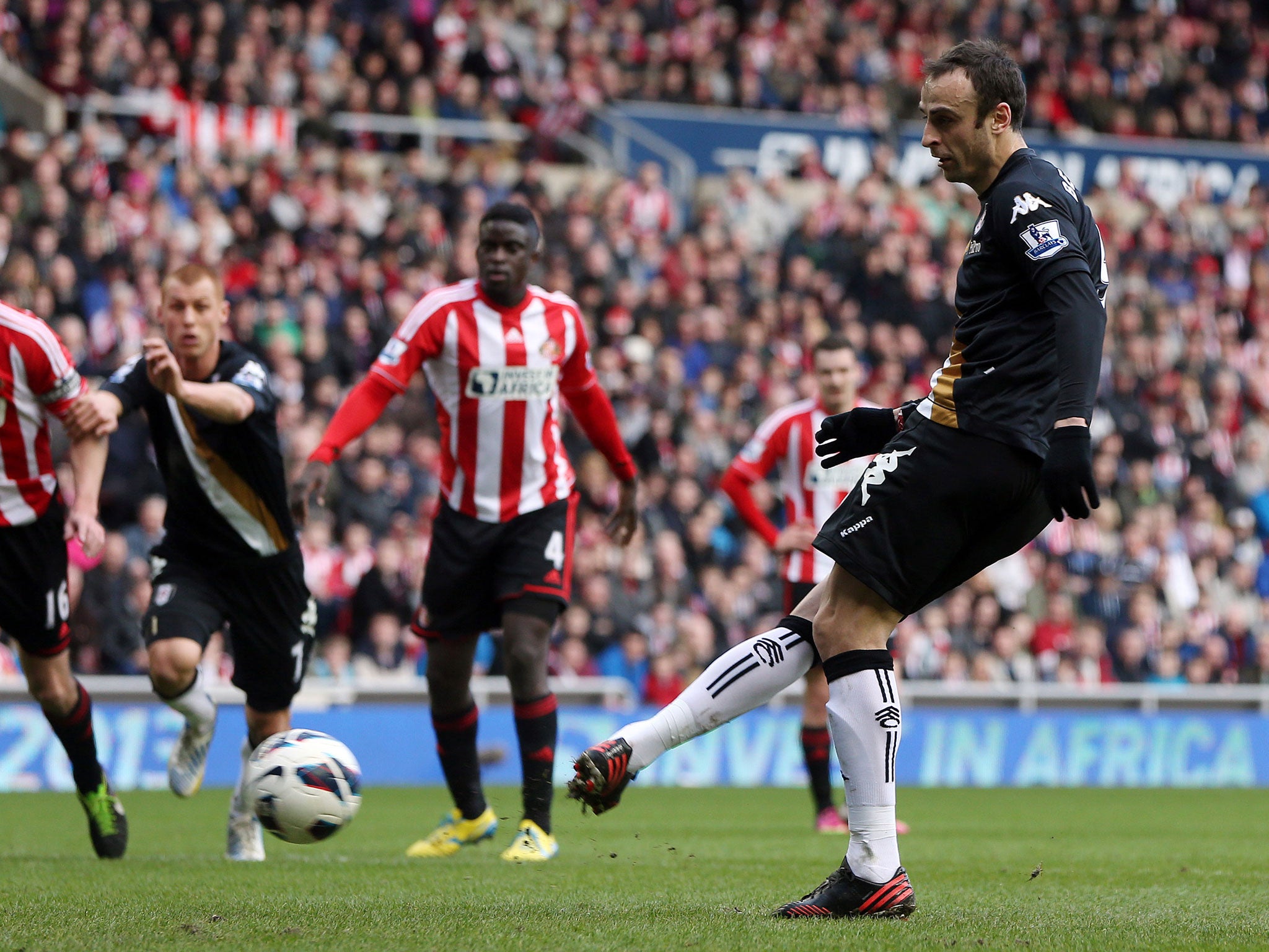 Dimitar Berbatov of Fulham scores from the penalty spot