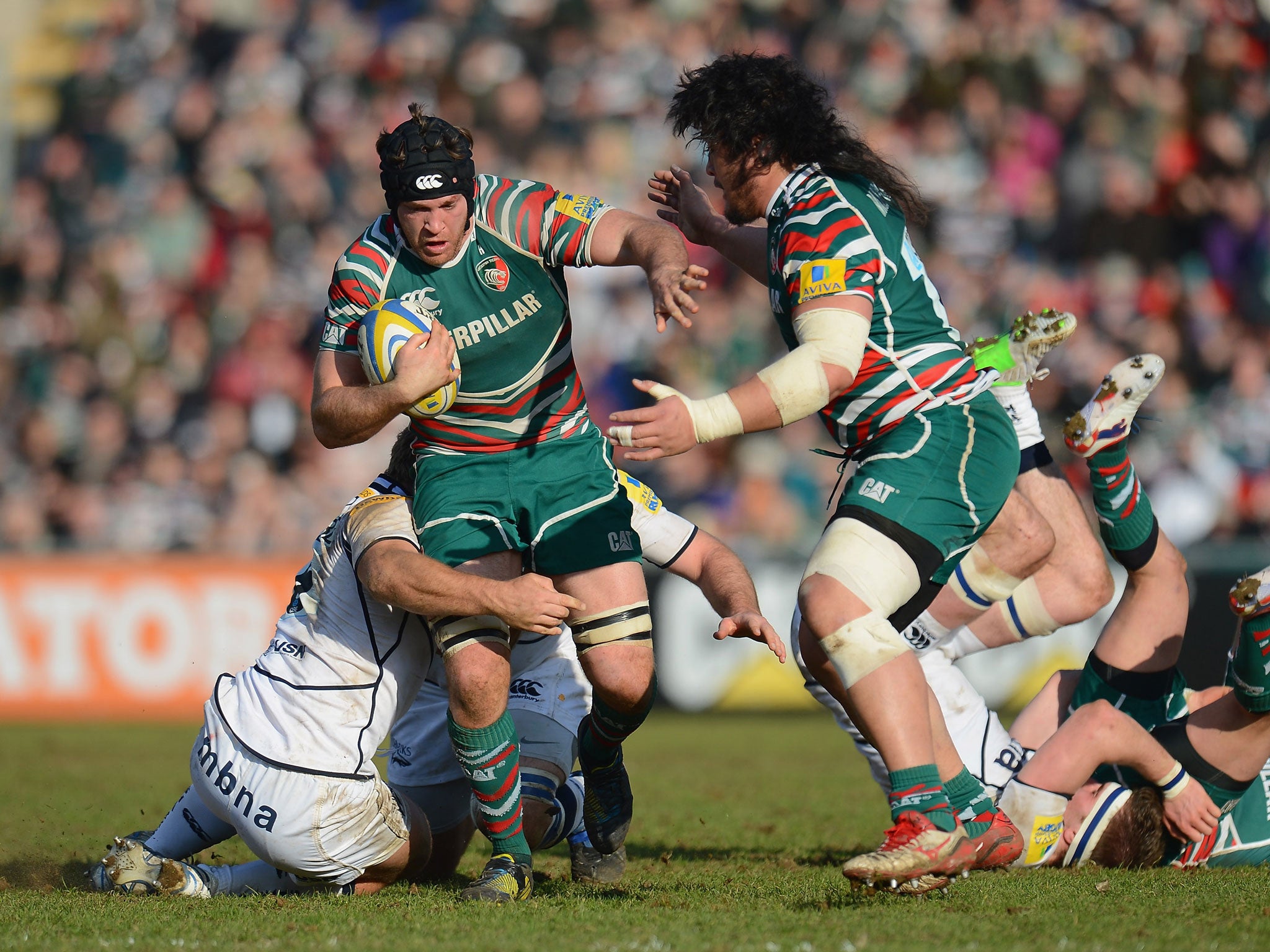 Julian Salvi of Leicester Tigers breaks through the Sale Sharks defence