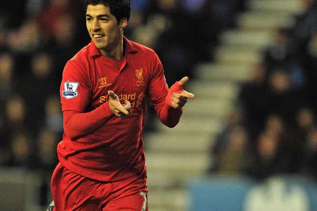 Liverpool's Uruguayan striker Luis Suarez celebrates scoring their second goal