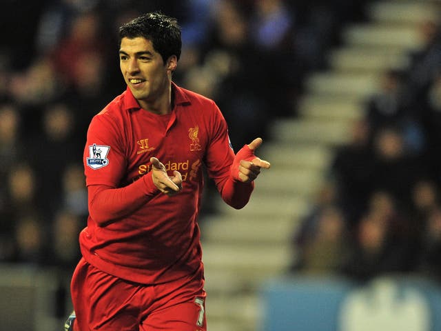 Liverpool's Uruguayan striker Luis Suarez celebrates scoring their second goal