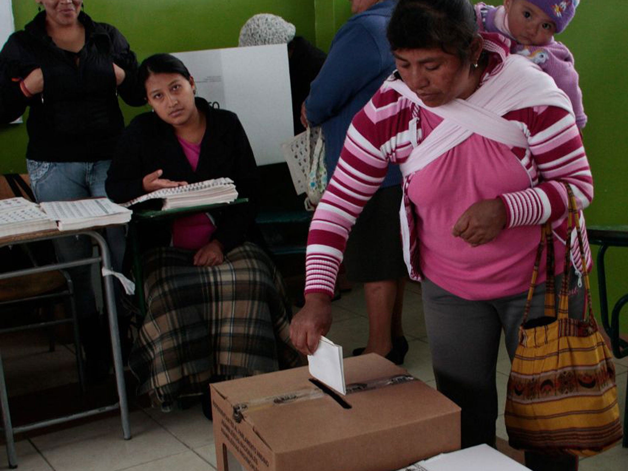 Citizens in polling stations in Quito