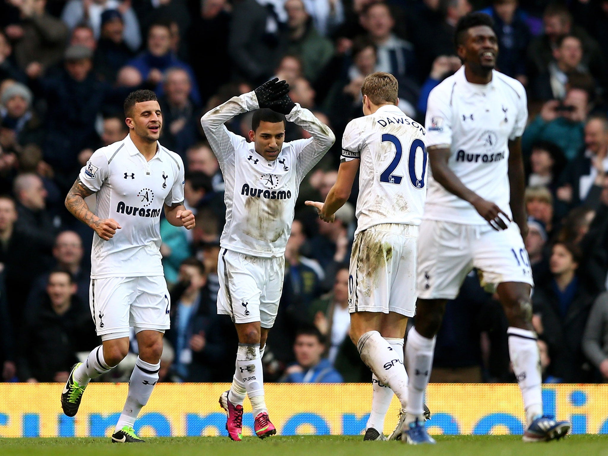 Aaron Lennon of Spurs celebrates with his captain Michael Dawson after scoring his team's second goal