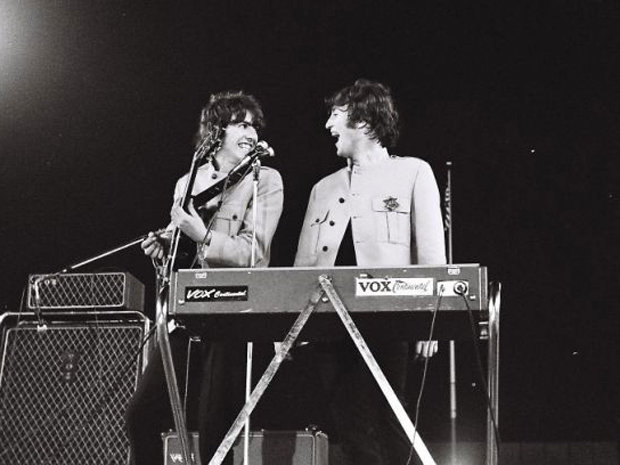Handout photo issued by Omega Auctions of George Harrison (left) and John Lennon during The Beatles iconic Shea Stadium performance in August 1965 in New York