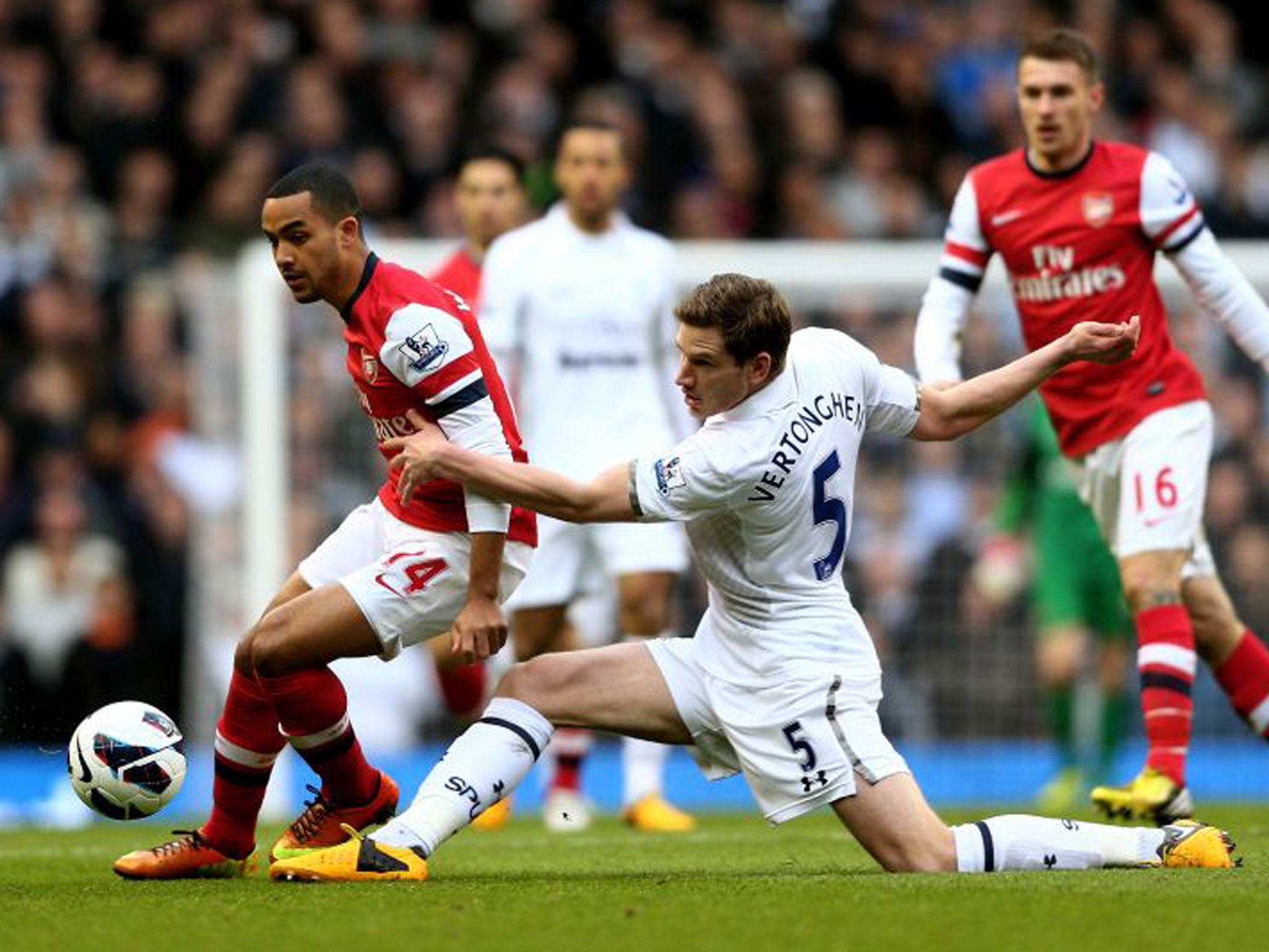 Tottenham’s Jan Vertonghen nicks the ball away from Theo Walcott of Arsenal yesterday