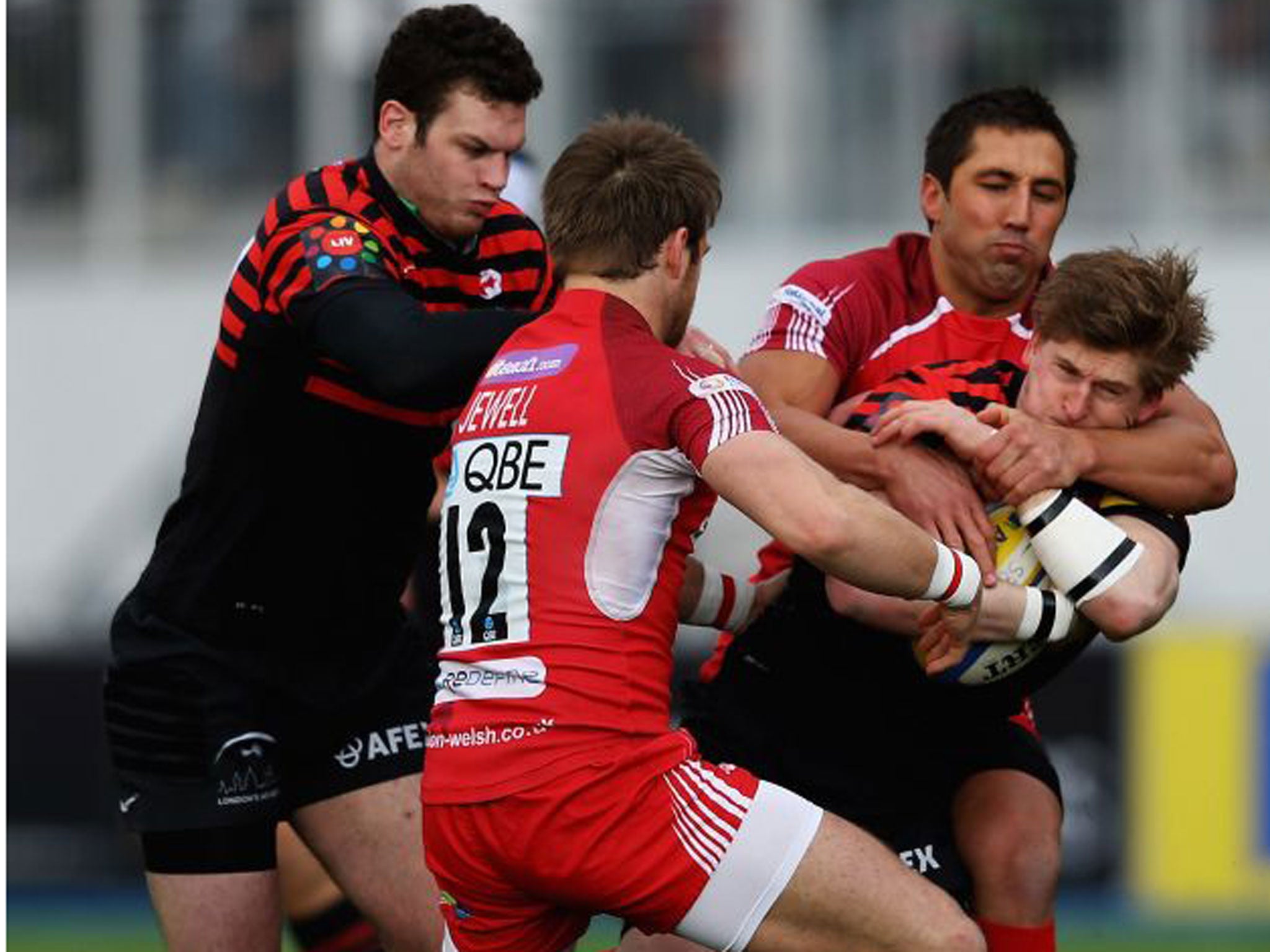 Gavin Henson, of London Welsh, ensures there is no way through for Saracens’ tryscorer David Strettle this time