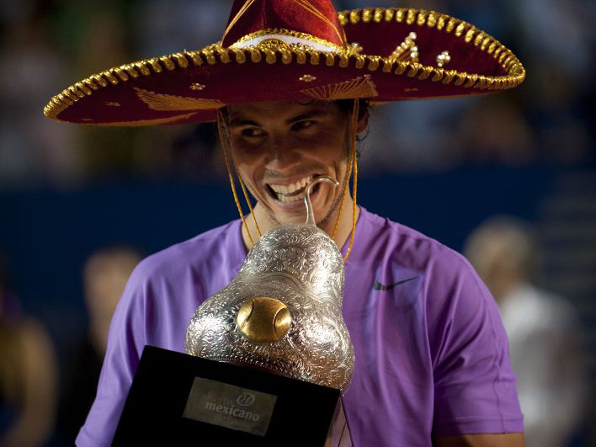 Rafael Nadal holds the
huge Mexican Open
trophy after his win
on Saturday