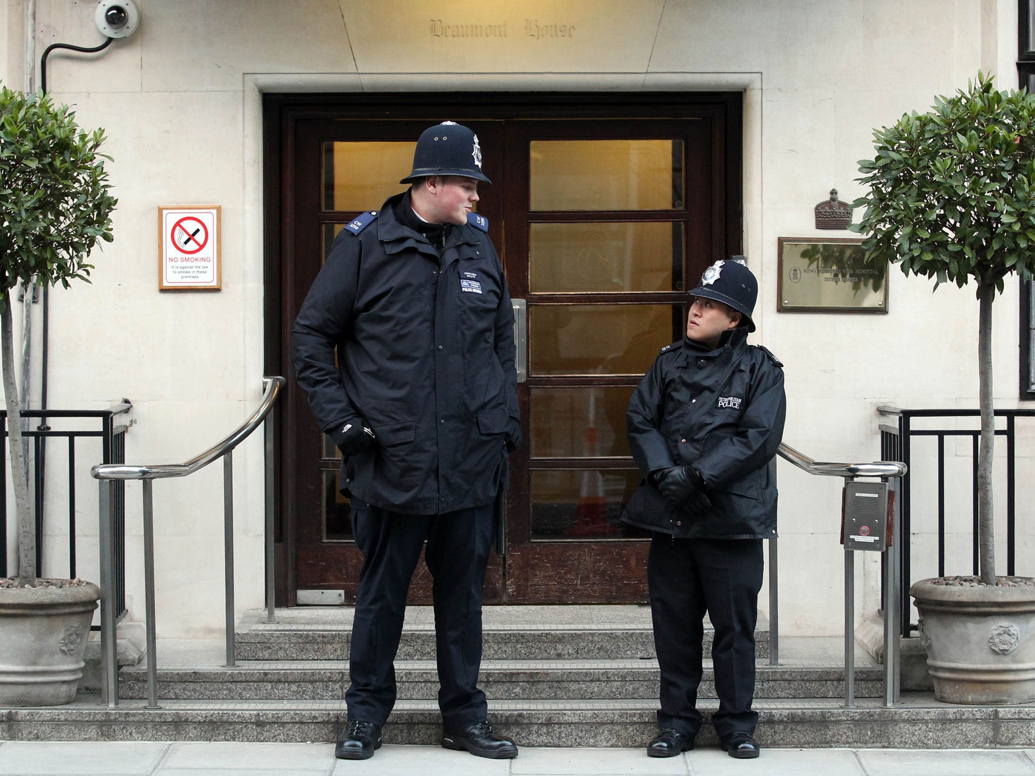 Pc Anthony Wallyn (left), who stands at 7ft 2ins tall, towering over his colleague, Pc Tony Thich, who is 5ft 6ins and the smallest officer in the Met's Westminster Borough Support Unit