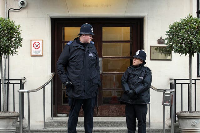 Pc Anthony Wallyn (left), who stands at 7ft 2ins tall, towering over his colleague, Pc Tony Thich, who is 5ft 6ins and the smallest officer in the Met's Westminster Borough Support Unit