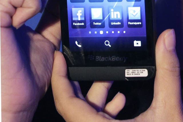 A model holds a BlackBerry Z10 during its launch in Jakarta March 4, 2013. 
