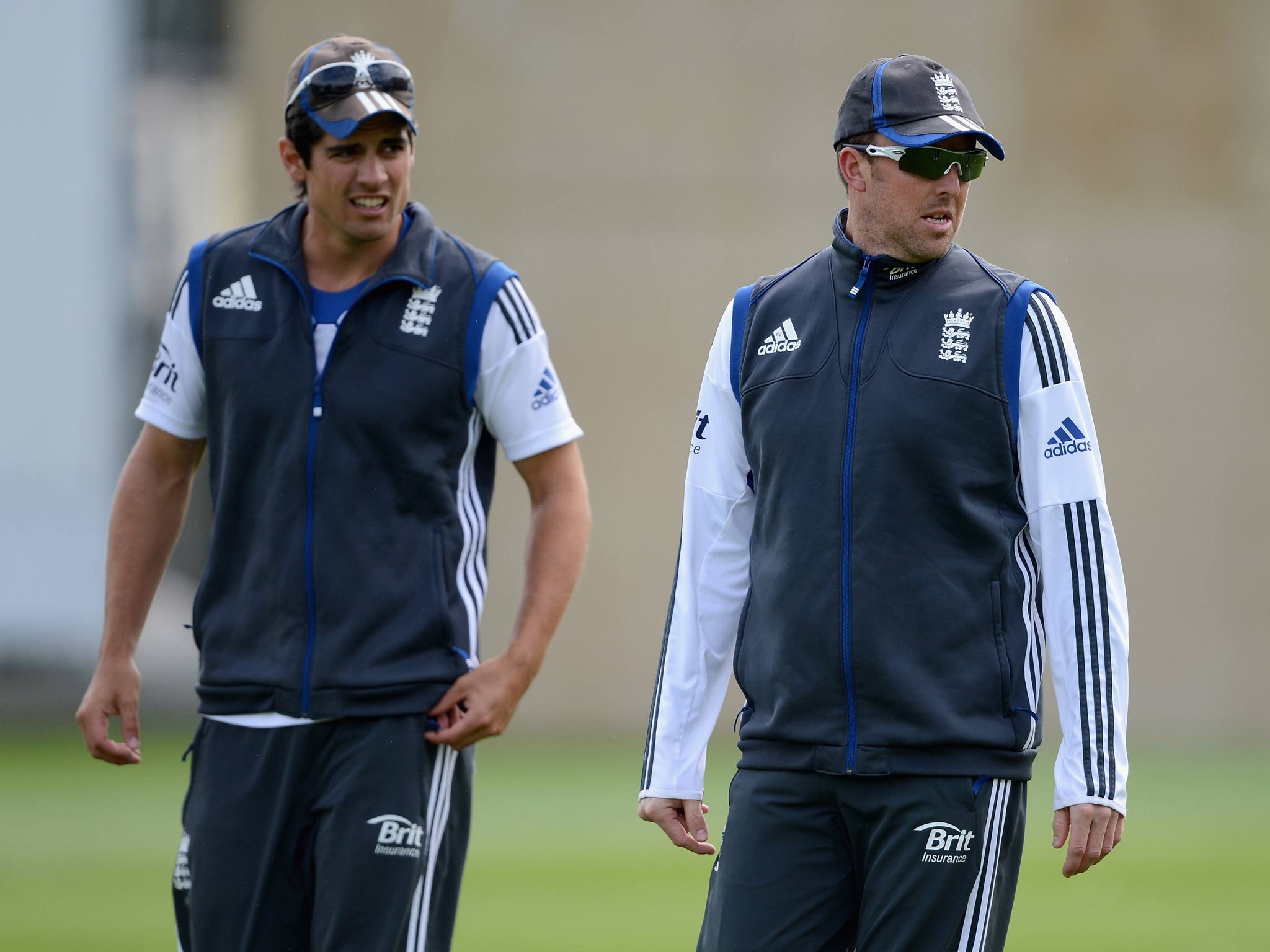 Graeme Swann of England with captain Alastair Cook