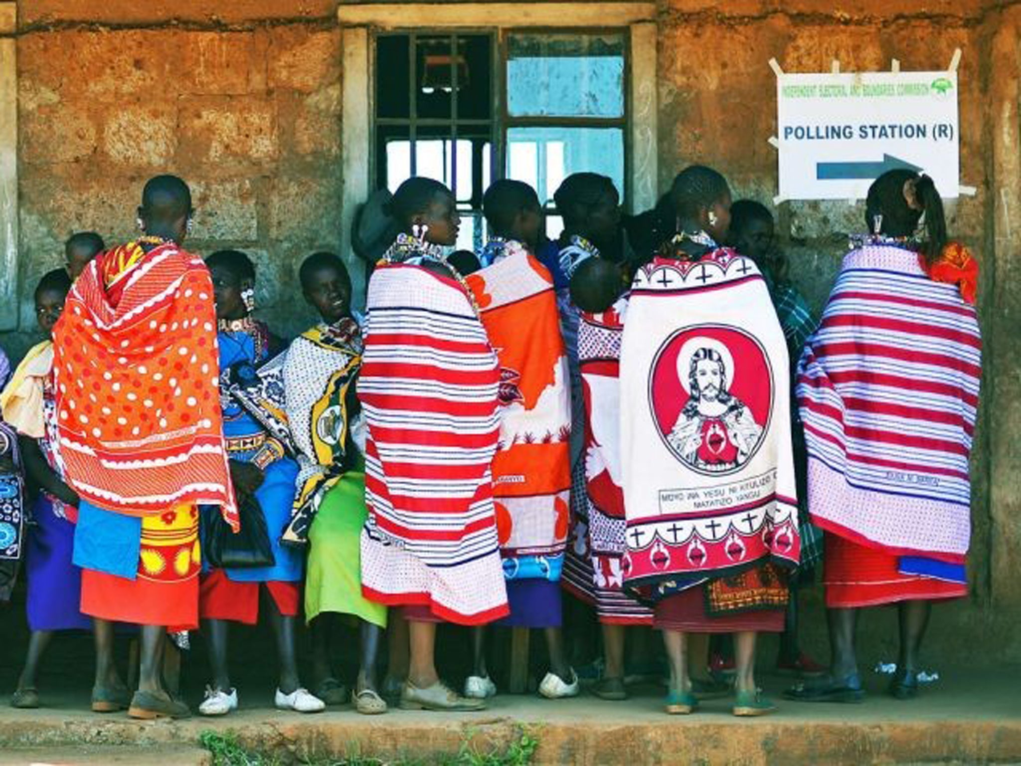 Maasai women queue to vote in Ilngarooj, Maasailand