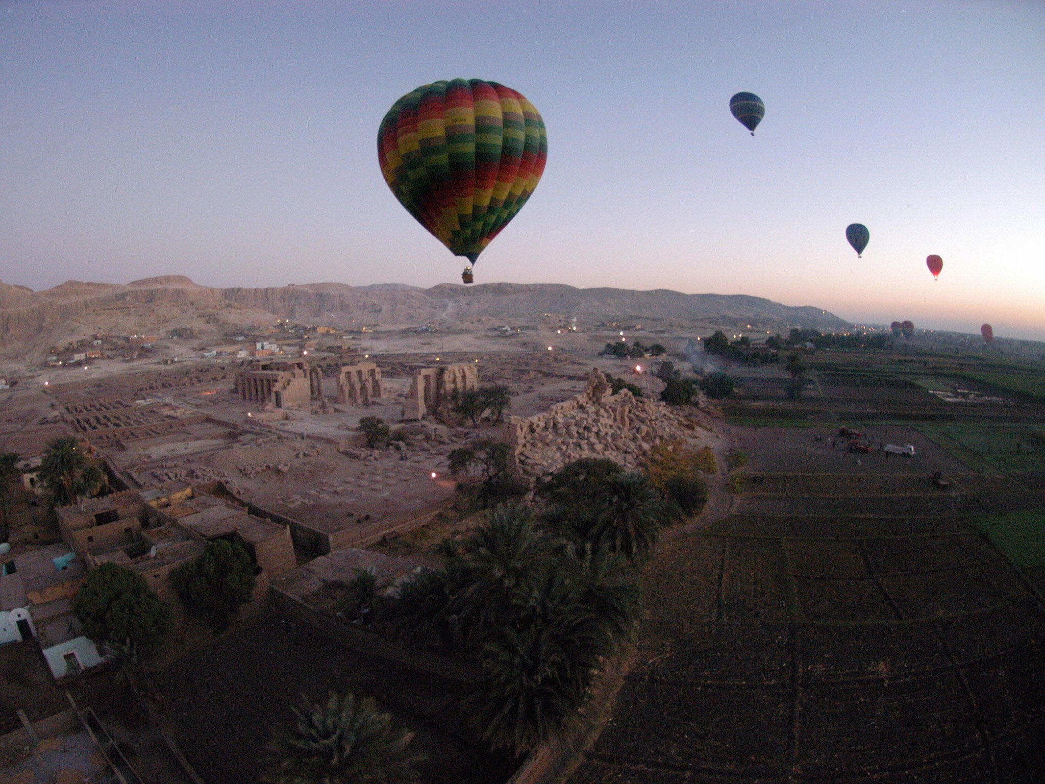 Tourist hot air balloons float during dawn across Egypt's Valley of the Kings, near Luxor on November 15, 2007. 19 people were killed when their hot air balloons crashed around the Nile resort town of Luxor on February 26th 2013.