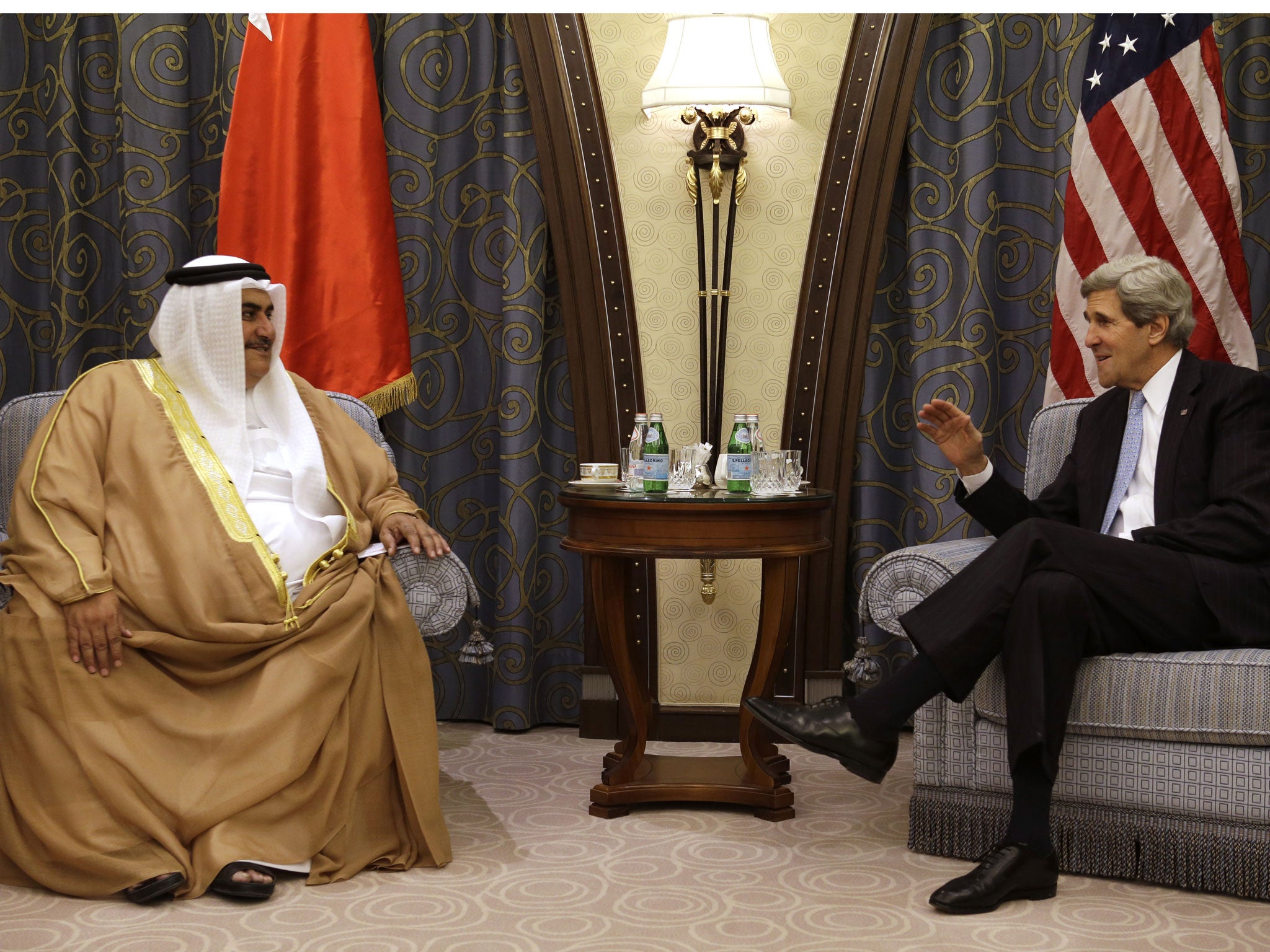 U.S. Secretary of State John Kerry (R) meets with Bahraini Foreign Minister Sheikh Khalid al-Khalifa at a hotel in the Saudi capital Riyadh on March 4, 2013. Saudi Arabia is the seventh leg of Kerry's first official overseas trip.