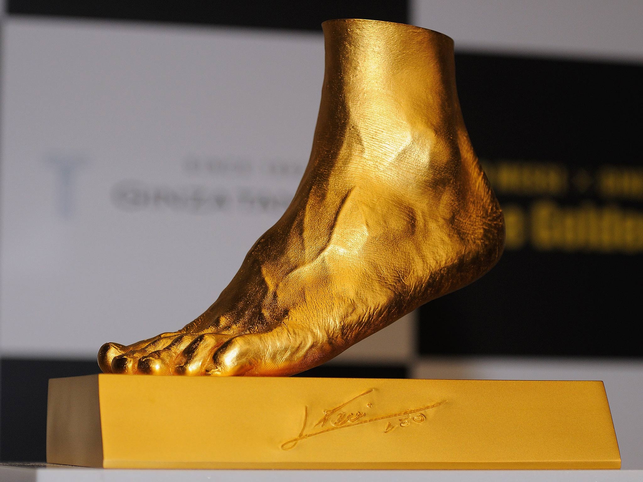 A gold cast of Lionel Messi's left foot