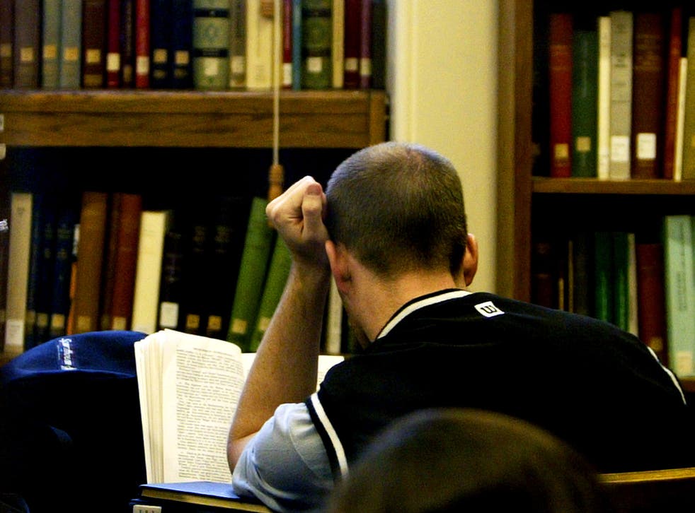 A student studies in the main library at the University College London on December 1, 2003 in London.