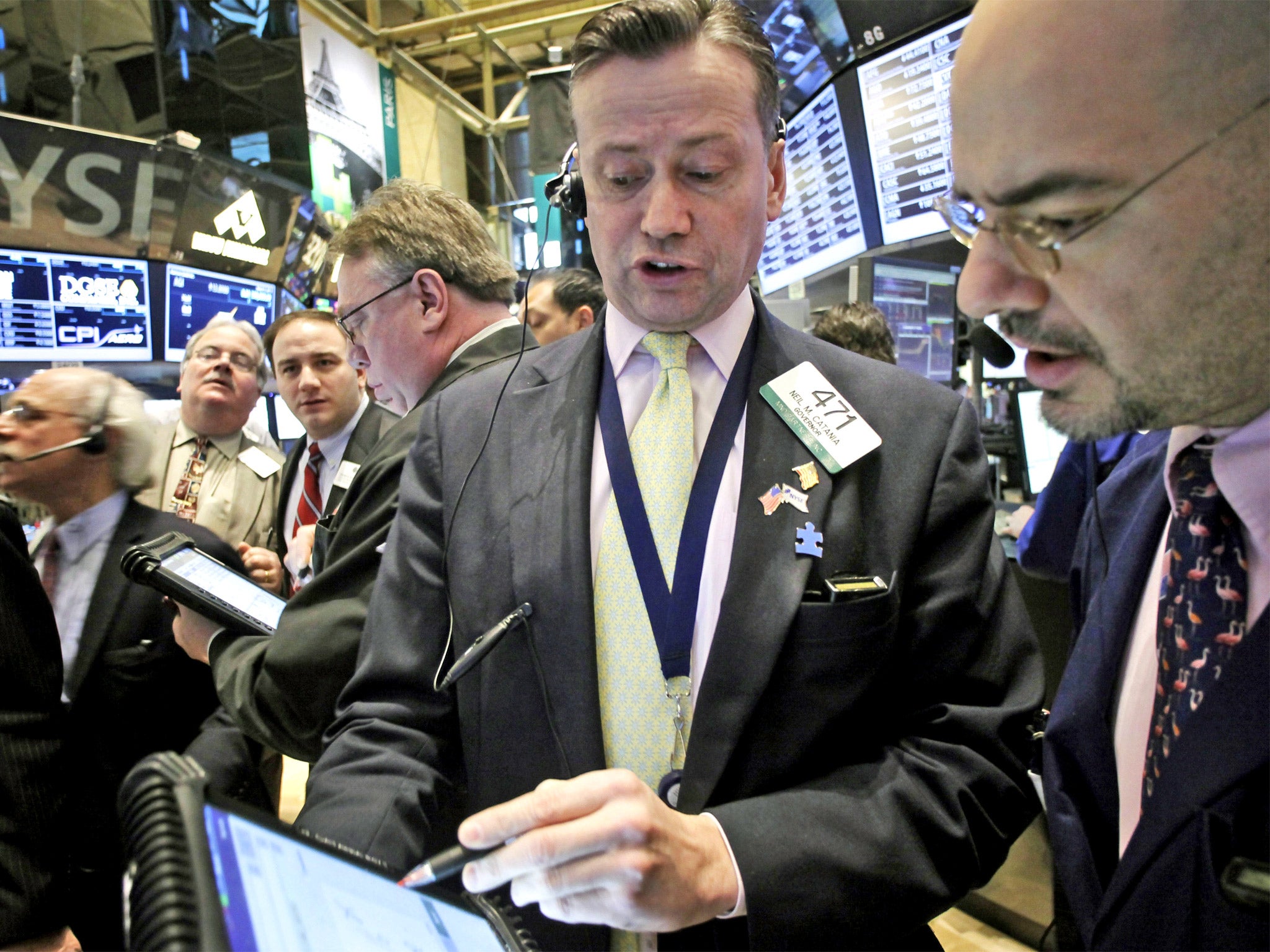 Traders on the floor of the New York Stock Exchange on Tuesday, when the Dow Jones reached an all-time high