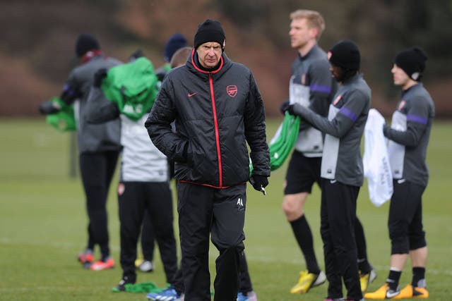 Arsene Wenger trains with his Arsenal players