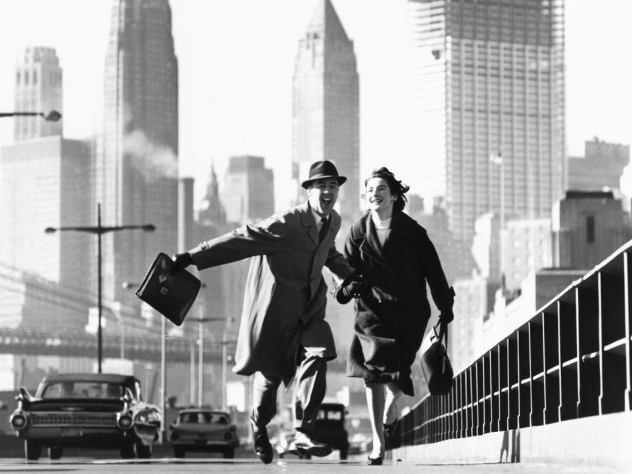 This 1959 image of a carefree couple on Brooklyn Bridge running towards the camera with the New York skyline as their backdrop, is one of Norman Parkinson's most famous shots