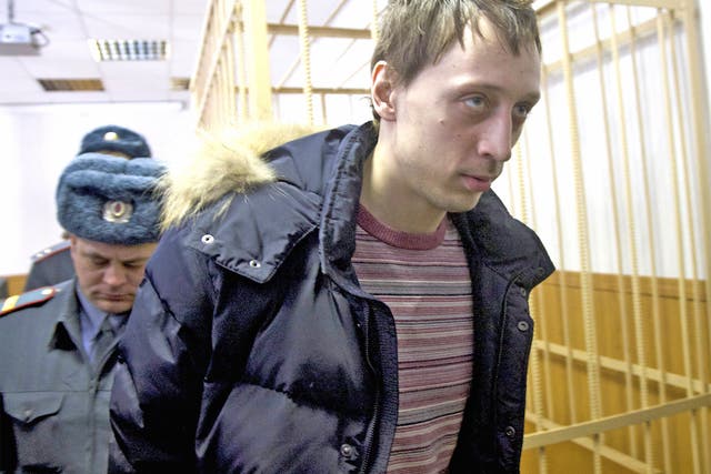 Pavel Dmitrichenko is led into court