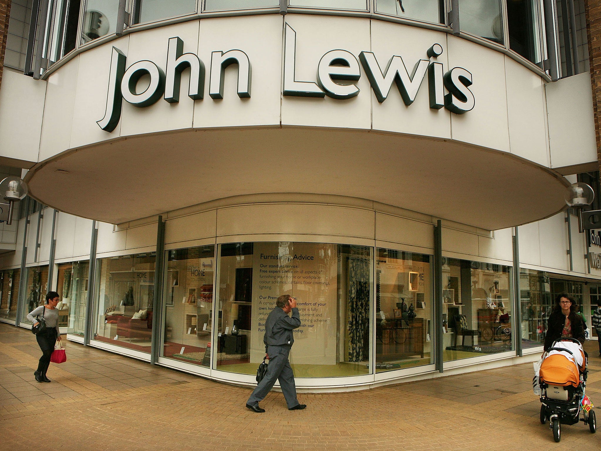 Shoppers pass a John Lewis store on September 11, 2008 in Kingston-Upon-Thames, England.