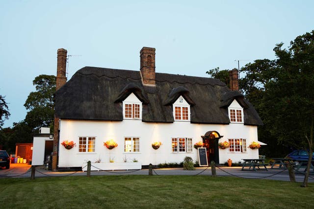 The Three Horseshoes is a thatched building which was once the village pub