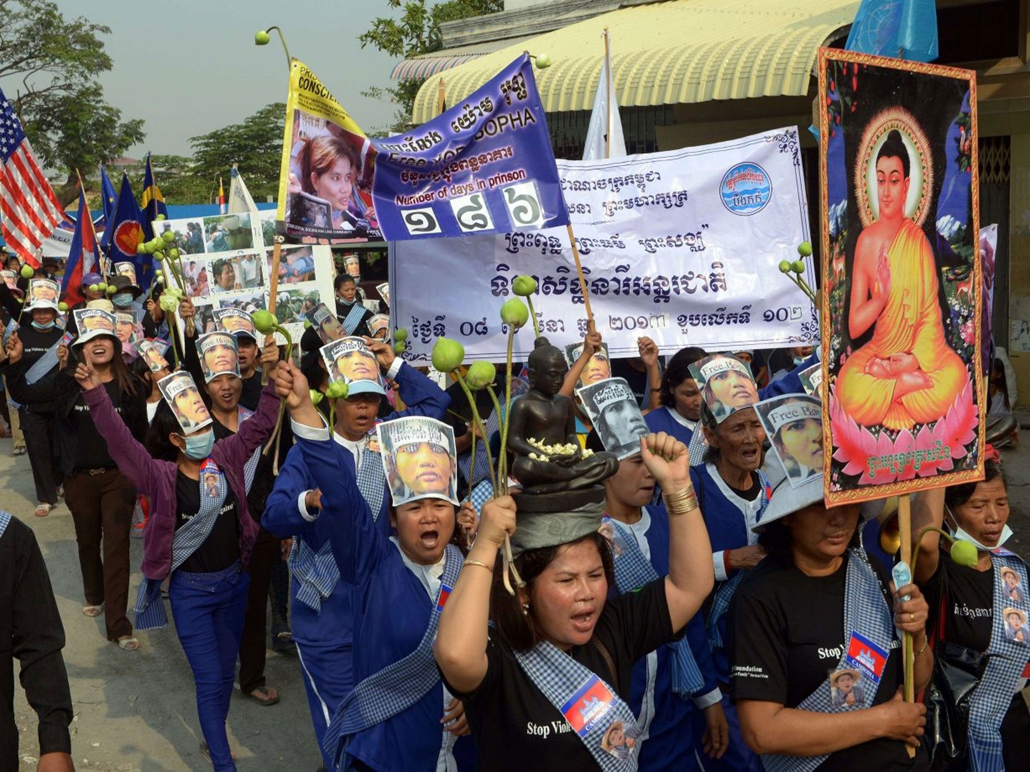 Cambodian women from Boeung Kak community shout slogans during a march on International Women's Day, Phnom Penh, March 8th 2013.