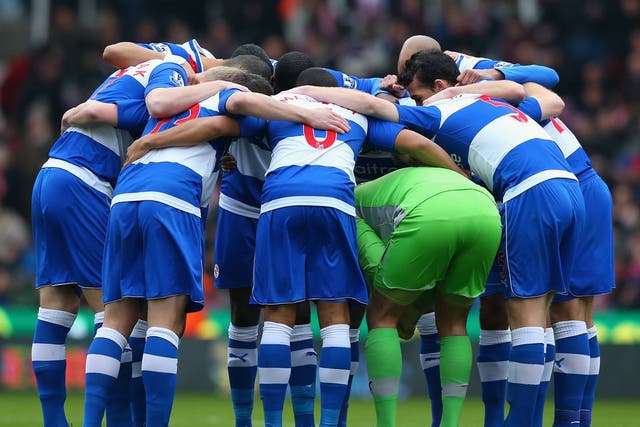 Reading's players huddle together