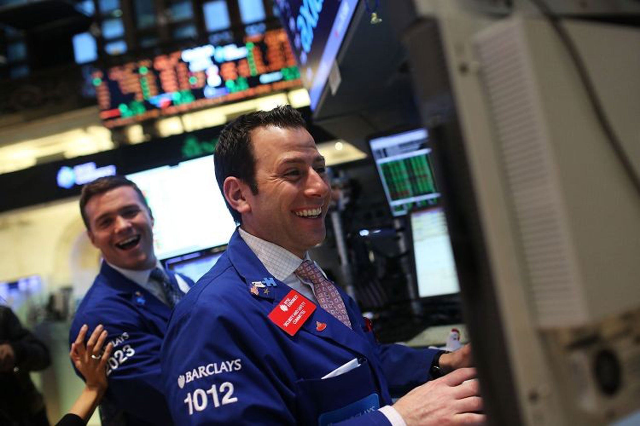 Traders celebrate the Dow's all-time high, but UK investors are advised not to get too excited