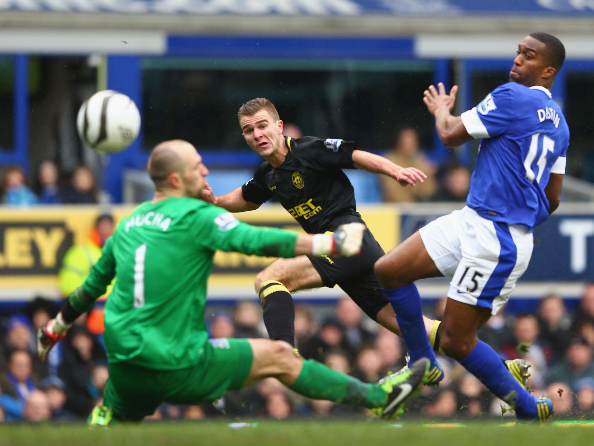 Callum McManaman (C) of Wigan Athletic scores his sides third goal during the demolition of Everton in the last round