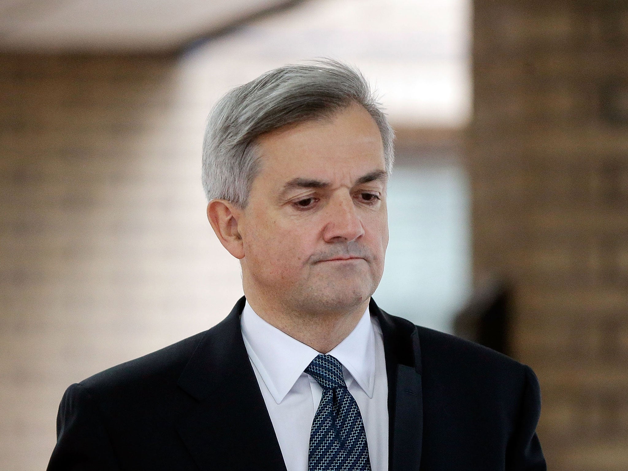 Former Cabinet Minister Chris Huhne leaves Southwark Crown Court to make a statement on February 4, 2013 in London, England