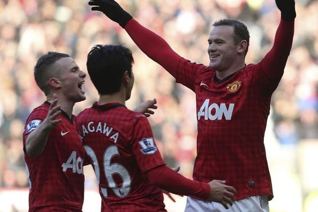 Wayne Rooney celebrates after scoring against Chelsea yesterday 