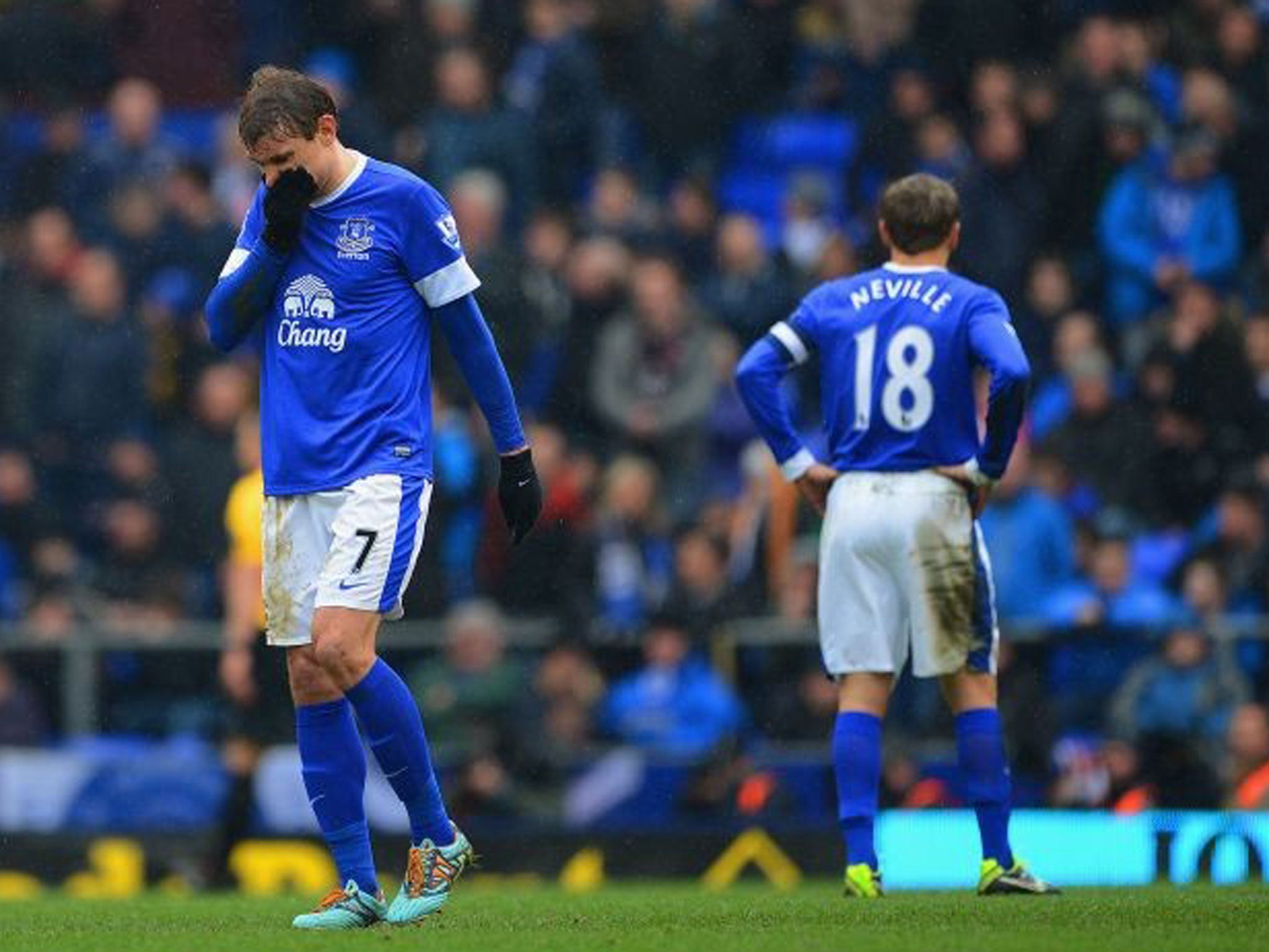 Nikica Jelavic (left) and Phil Neville during Everton's 3-0 defeat to Wigan