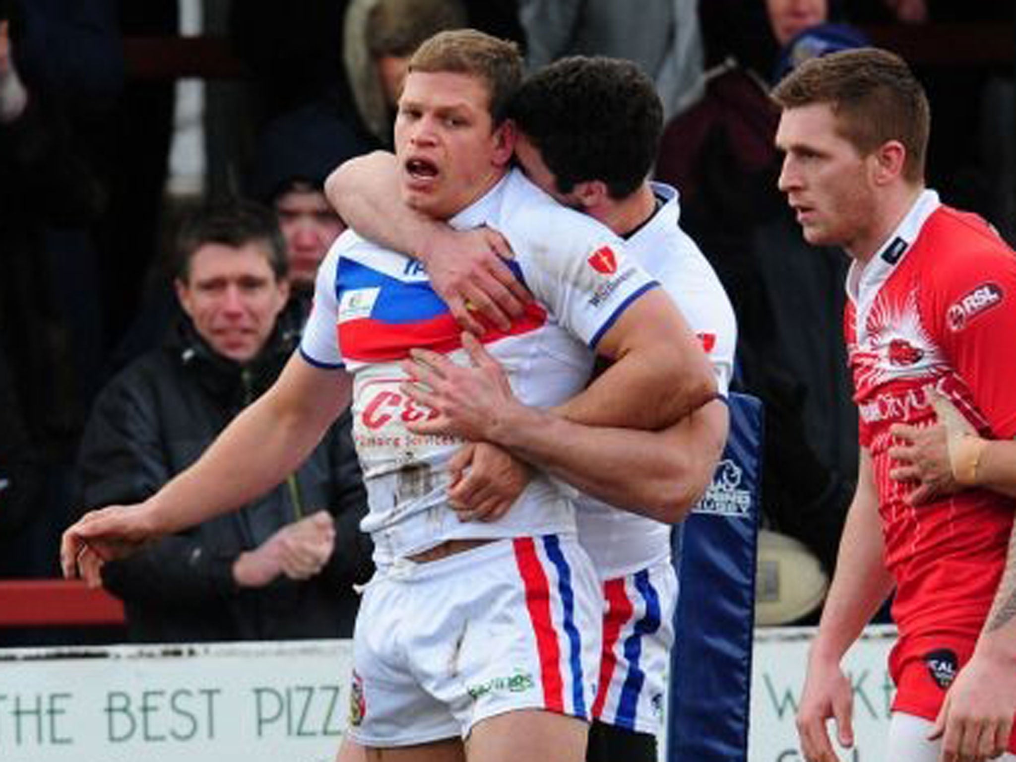 Wakefield's Peter Fox (left) is congratulated after scoring a try