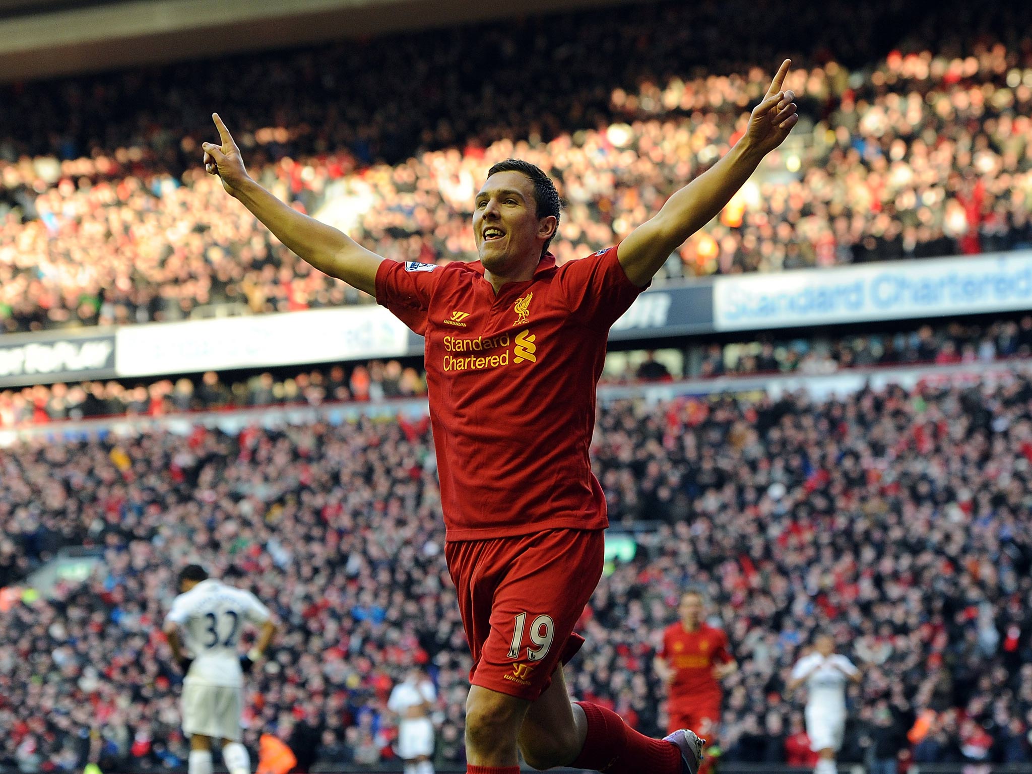 Stewart Downing of Liverpool celebrates after scoring against Spurs