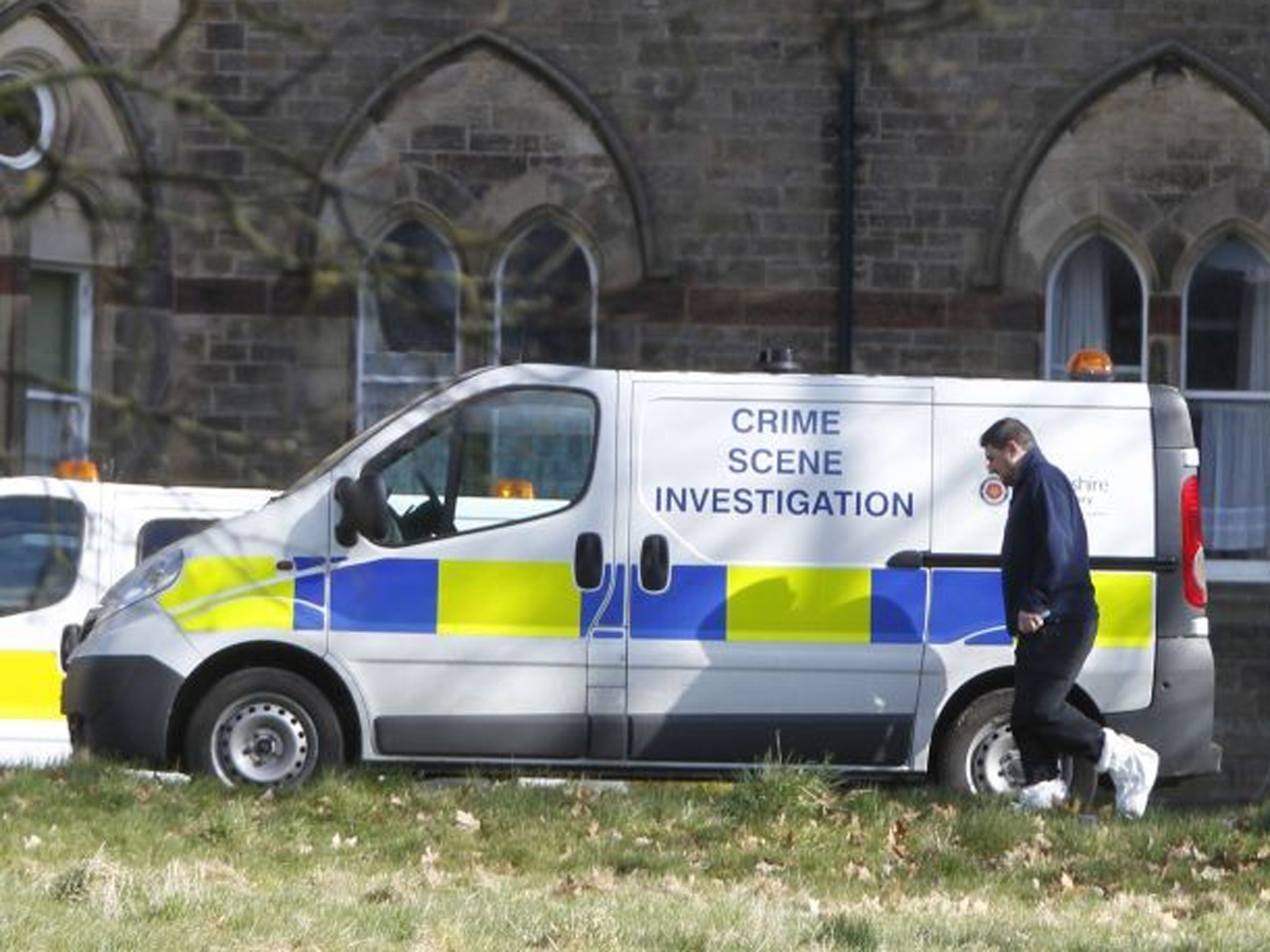 A view of CSI vans at the Jamea Al Kauthar school in Lancaster, following the arrests of three men over claims of sexual assault and false imprisonment