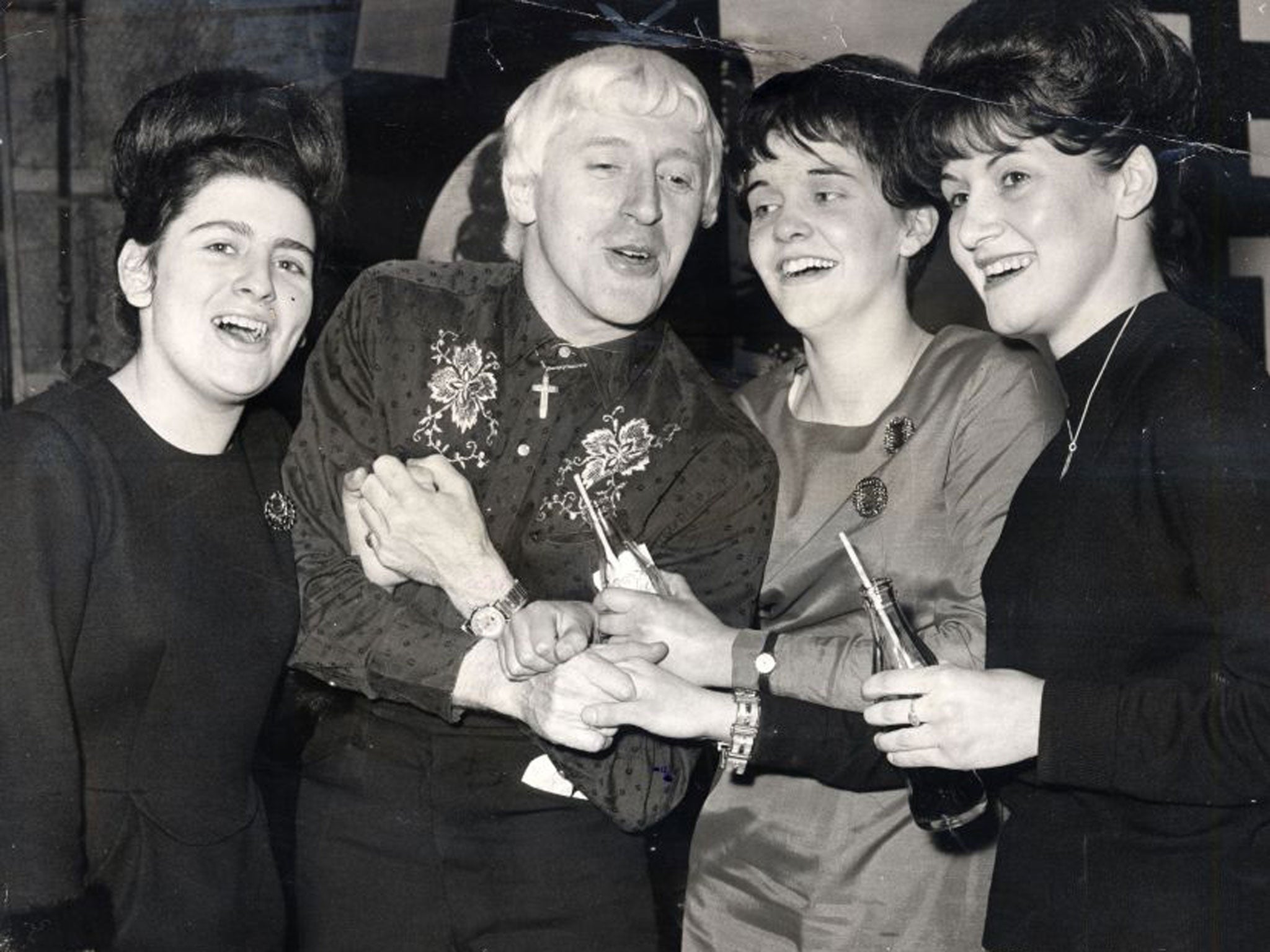 Jimmy Savile with Beatles fans in 1965