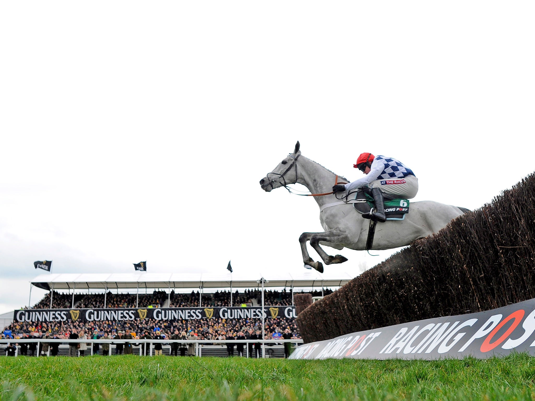 Barry Geraghty riding Simonsig (C) on their way to winning the Racing Post Arkle Challenge Trophy Steeple Chase