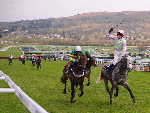 Ruby Walsh celebrates winning The William Hill Supreme Novices' Hurdle Race on Champagne Fever during Champion Day at Cheltenham Racecourse