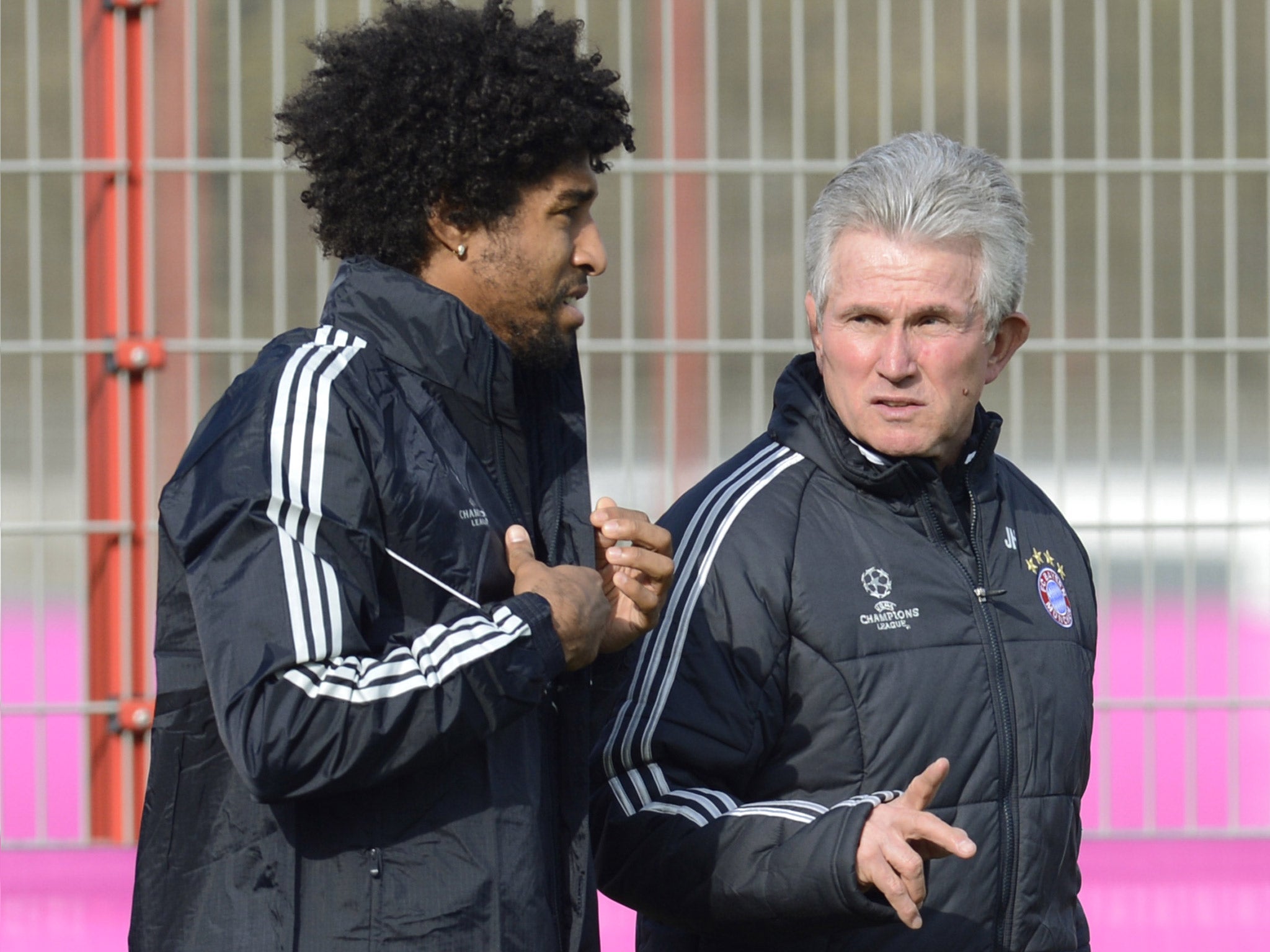 Jupp Heynckes chats with defender Dante in Munich