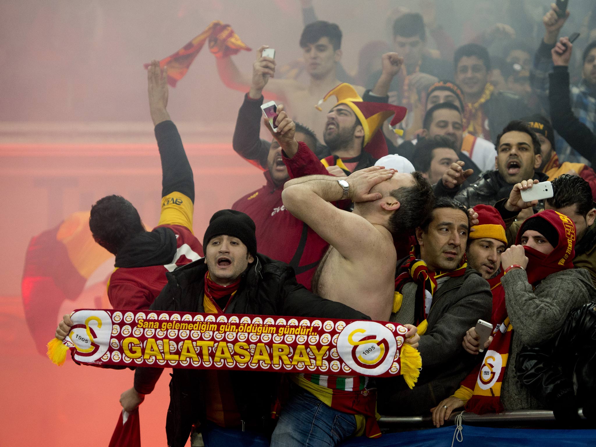 Galatasaray fans celebrate during their side's victory over Schalke