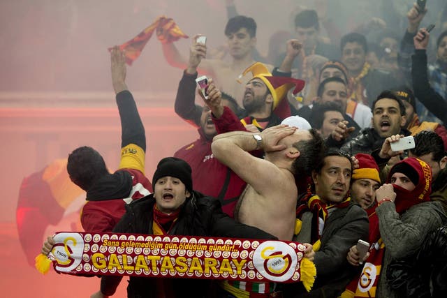 Galatasaray fans celebrate during their side's victory over Schalke 