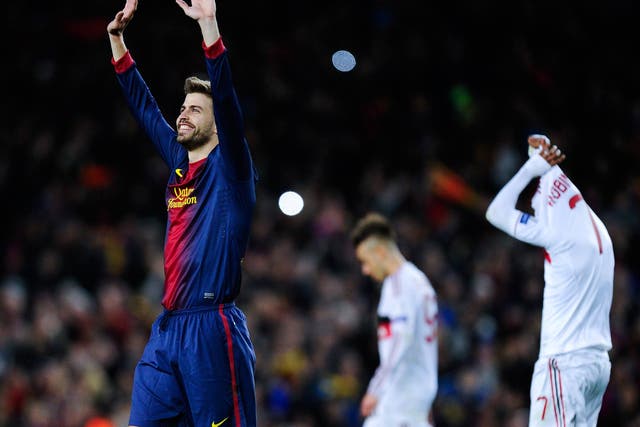 Gerard Pique of Barcelona celebrates at the end of his side's victory over AC Milan
