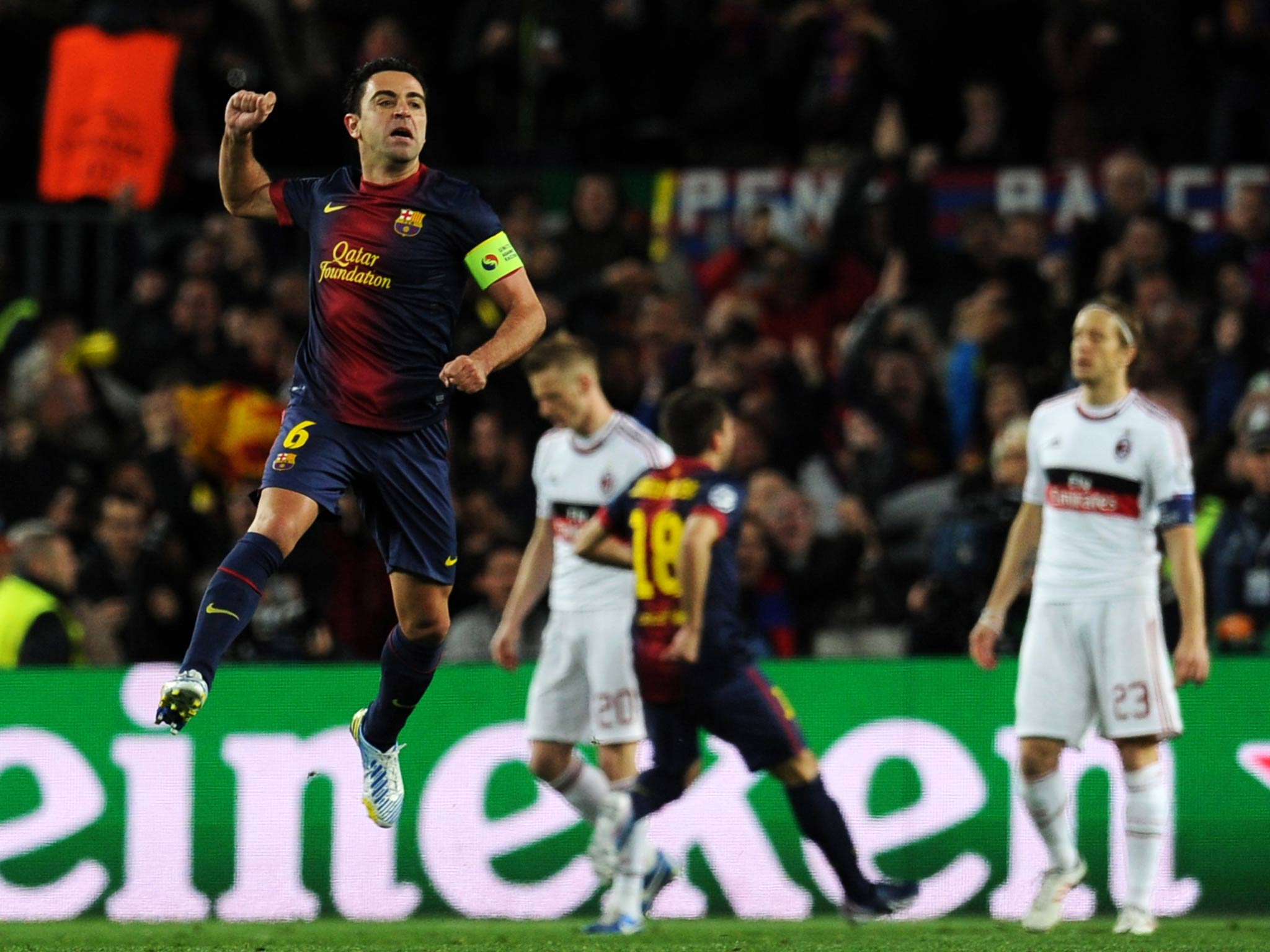 Xavi in action against AC Milan